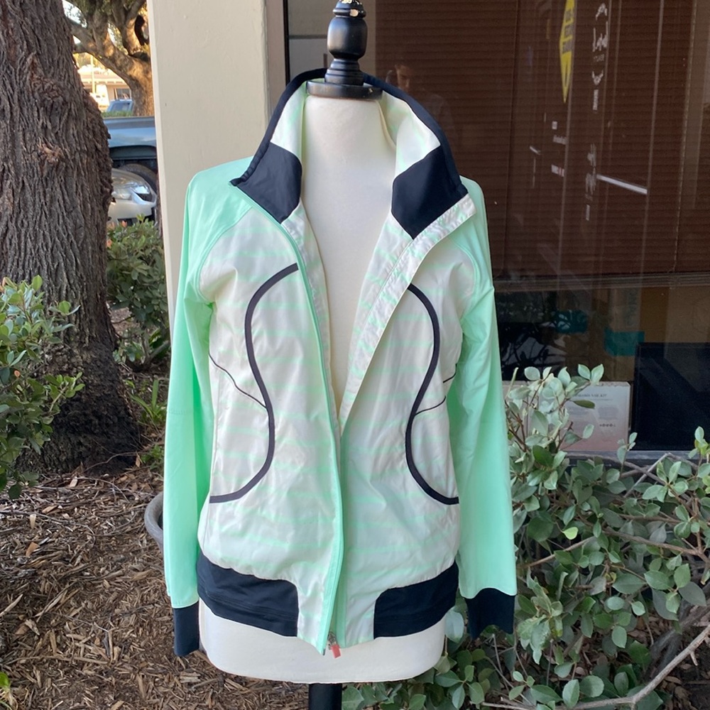 Lululemon- woman’s athletic jacket. Multi color size slim fit Medium